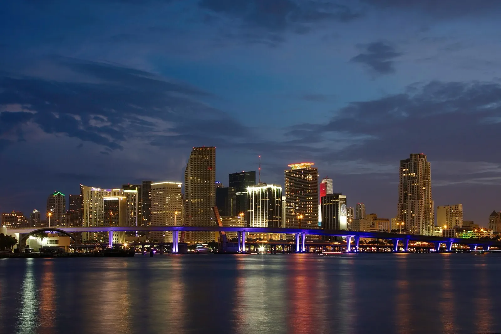 Condos in Miami for sale — Miami skyline at dusk over the water